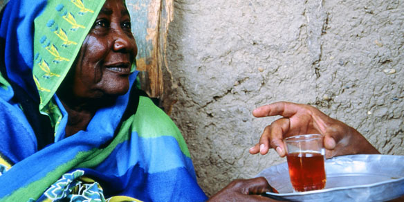 Sudanese woman serving tea, Sudan